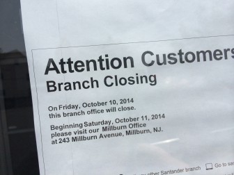 Santander Maplewood Branch closing notice posted at the branch entrances