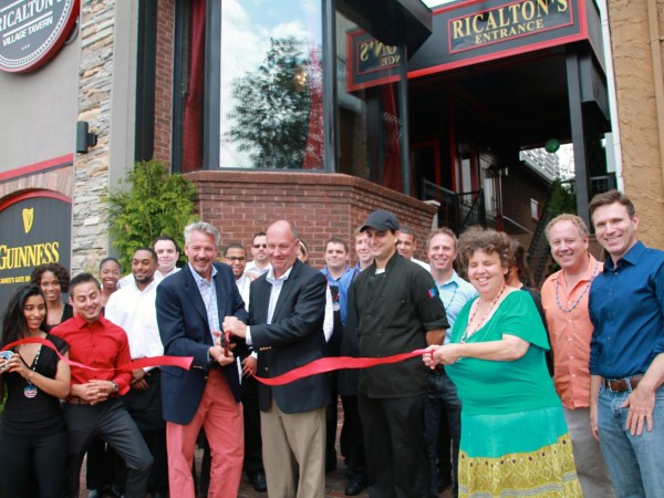 Co-owners Stony Johnson and Tom McLaughlin cut the ribbon at Ricalton's grand opening, July 26, 2014.