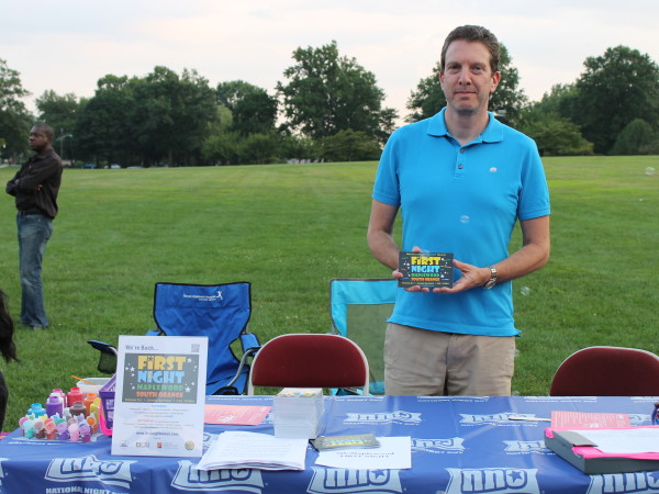 Former South Orange Village Trustee Michael Goldberg promotes First Night at the National Night Out event on August 5.