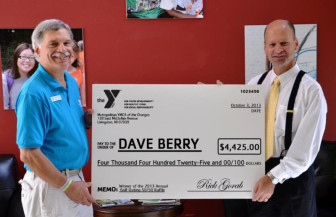 YMCA's Dave Berry winning the raffle at 2013 Golf Tournament.