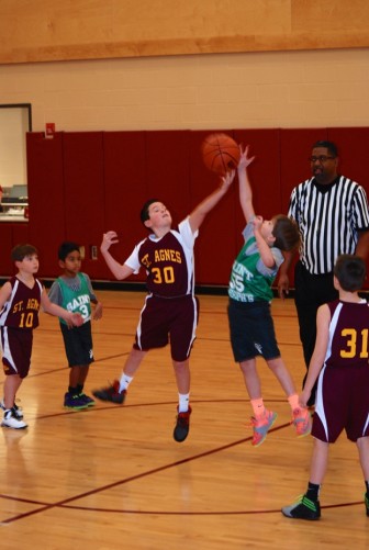 Tyler Craig on the opening tip off of the St. Joseph Celtics Third-Grade boys game against St. Agnes 