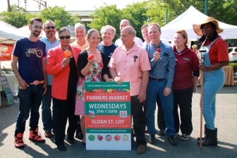 Village President Sheena Collum with village trustees and SOVCA staff at the South Orange Farmers Market