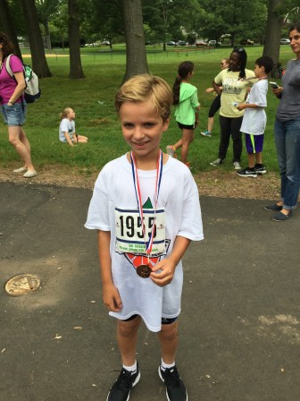 Henry Peacock, winner of the boys 9-10 category at the Two Towns Triathlon 2015