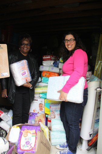 Mothers & More Diaper Drive coordinator Annemarie Conte with a staff member from Sierra House