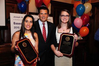 N.J. State Senator and Essex County Deputy Chief of Staff M. Teresa Ruiz (left) and ( right) Andrea Bowen, Executive Director of Garden State Equity, receive award from Essex Cty Executive DiVincenzo