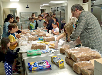 TSTI congregants prepare sandwiches to deliver to the Isaiah House shelter in East Orange. 