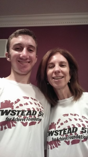 Helen DuBowy and her son Adam model the 2015 Newstead 5K t-shirt.