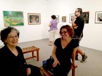 Sarah Canfield speaking with Florence Weisz, Luis Alves in background. Photographed by Susan Napack