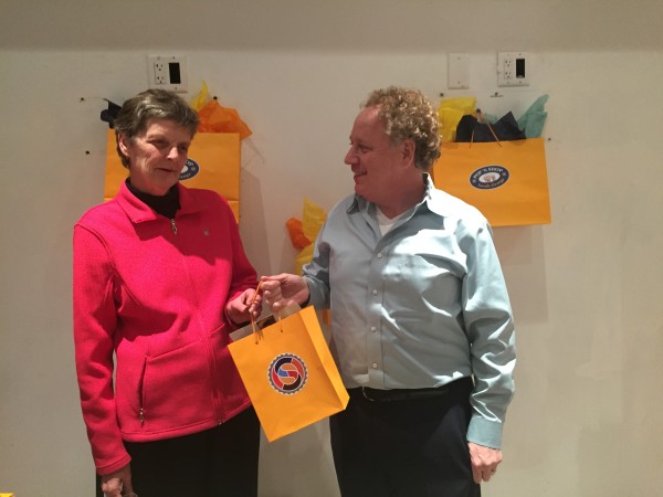 SOVCA Executive Director Bob Zuckerman awards $500 in gift cards to Pat Taronis of South Orange. Dec. 1, 2015. Photo courtesy of SOVCA.