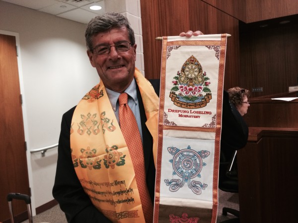 No, those aren't his League awards: Maplewood Mayor Vic DeLuca shows off gifts from the Tibetan Buddhist monks of the Drepung Loseling Monastery after the Maplewood Mandala project in August.