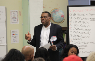 Walter Fields moderates the Access & Equity session at the Education Summit on Nov. 10, 2015.