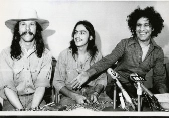 Mayer Vishner sitting between Tom Forcade (left) and Abbie Hoffman, 1971.