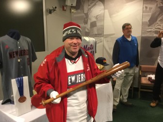  Luchs holding Babe Ruth’s bat, used to earn his 500th home run, as well as the team photo when the Gold Metals were handed out.  