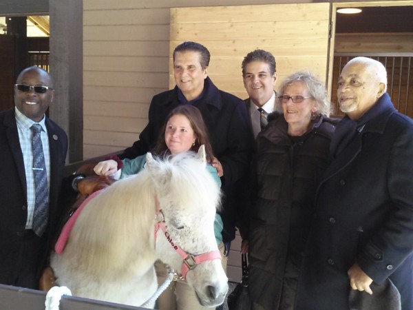 Essex County Executive Joseph N. DiVincenzo, Jr. (second from left) announced on Monday, March 21st that the new Pony Ride Trail at Essex County Turtle Back Zoo is open to the public. With the County Executive and Chloe, one of the horses, are (from left) Freeholder Wayne Richardson, Turtle Back Zoo Essex Farm Manager Jennifer Proscia, Chief of Staff Philip Alagia, Freeholder Patricia Sebold and Deputy Chief of Staff William Payne. (Photo courtesy of Essex County)