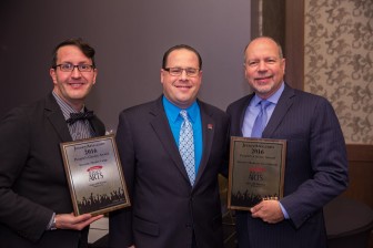 Paper Mill Playhouse Managing Director Todd Schmidt and the theater’s Director of Press and Public Relations Shayne Austin Miller accept the awards.