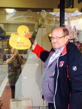 Maplewood Stationers owner Charlie Gianni shows off his duck decal.