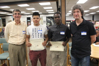 The brothers of the late CHS science teacher Marty Panek bestow scholarships on Fermin Martinez and Harold Ofori.