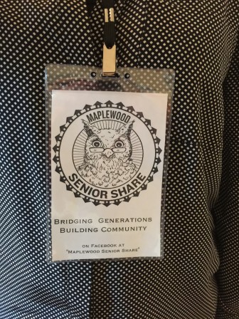 The Maplewood Senior Share logo, designed by Irene Dunsavage and Lara Tomlin, adorns lanyards worn by volunteers on the "Senior Canvass" tour.