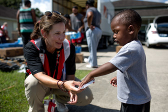 August 22, 2016. New Iberia, Iberia Parish, Louisiana. “It’s worth a million to help others,” says Jodi Bocco (West Long Branch, NJ) visits with Kadeem, 1, in New Iberia. Bocco is a Red Cross volunteer who provides emotional support to adults and children impacted by disasters, including the historic flooding in southern Louisiana. Photo by: Marko Kokic/American Red Cross
