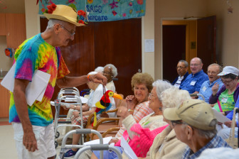  Pictured: Spend-A-Day participants enjoy a comedy act by Gene Hamilton. The SAGE Eldercare Spend-A-Day program offers older adults a safe place to spend the day with stimulating, structured activities that are individualized. 