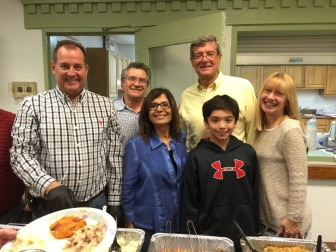 The Kikianis Family and Park Wood Diner staff, along with Mayor DeLuca, serve holiday dinner to seniors